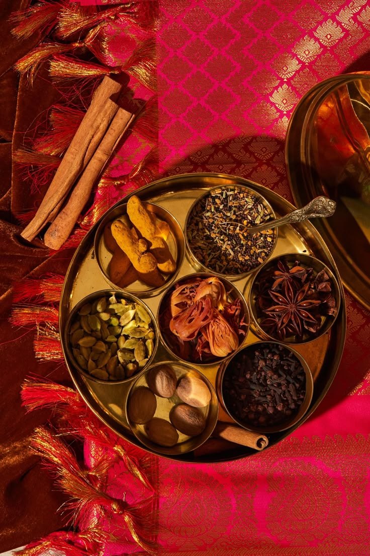 Whole spices in a brass thali